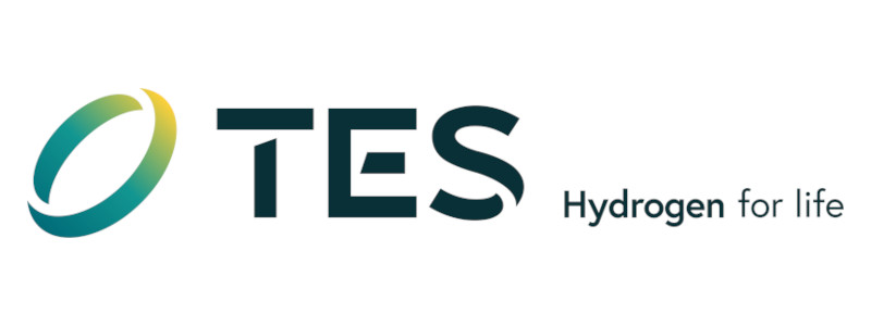 Das TES-Logo zeigt ein grünes und blaues kreisförmiges Design, mit dem Text 'TES' und dem Slogan 'Wasserstoff für das Leben'.